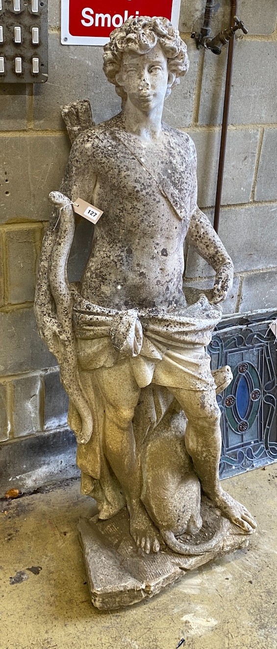 A reconstituted stone garden ornament of a huntsman with hound, height 140cm